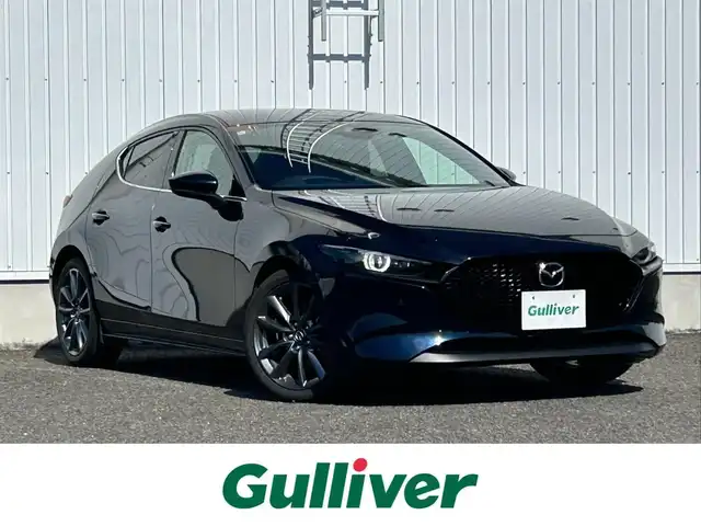 マツダ マツダ３ファストバック 20S ツーリング 熊本県 2024(令6)年 2万km ディープクリスタルブルーマイカ 純正ナビ/・AM/FM/USB/BT/HDMI/・アンドロイドオート/アップルカープレイ/・フルセグTV/全方位カメラ/レーダークルーズコントロール/ブラインドスポットモニター/ヘッドアップディスプレイ/スマートブレーキサポート/ハイビームコントロールシステム/レーンキープアシスト/前後ドライブレコーダー/D席メモリ付きパワーシート/前席シートヒーター/革巻きステアリング/ステアリングスイッチ/ステアリングヒーター/電動パーキングブレーキ/オートホールドブレーキ/アイドリングストップ/ETC/純正フロアマット/純正アルミホイール