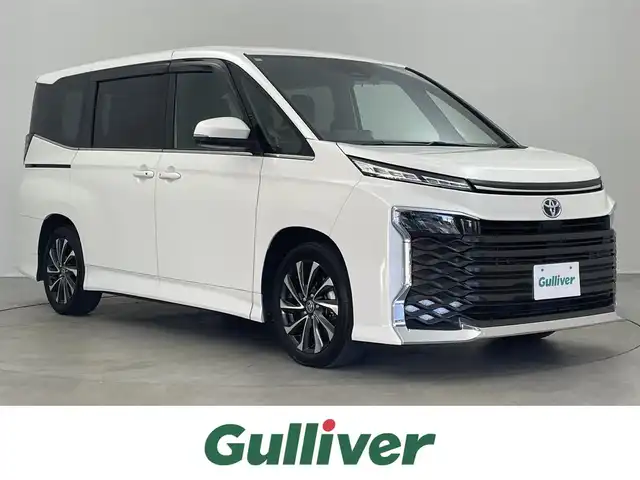 トヨタ ヴォクシー ハイブリッド S－Z 埼玉県 2023(令5)年 3.6万km ホワイトパールクリスタルシャイン 純正10.5インチディスプレイオーディオ/　Bluetooth USB MiraCast CD DVD フルセグ/フリップダウンモニター/両側パワースライドドア/トヨタセーフティセンス/レーダークルーズコントロール/レーンディパーチャーアラート/シートヒーター/前後ドライブレコーダー/ビルトインＥＴＣ２．０/ＬＥＤオートライト/オートハイビーム/ＡＣ１００Ｖ電源