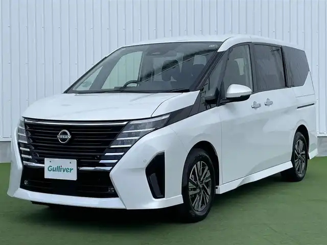日産 セレナ ハイウェイスター V 香川県 2024(令6)年 1.1万km プリズムホワイト プロパイロット/クルーズコントロール/ブラインドスポットモニター/オートホールド/両側パワースライドドア/バックカメラ/純正ナビ/純正フロアマット/純正アルミホイール16インチ/Bluetooth/ETC/パワーウィンドウ/オートエアコン/プッシュスタート/スマートキー