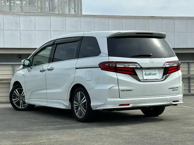 ホンダ オデッセイ ハイブリッド アブソルート・EXホンダセンジング 静岡県 2019(平31)年 3.1万km パール ホンダセンシング/・VSA（ABS＋TCS＋横すべり抑制）/純正7インチナビ/（CD/DVD/Bluetooth/FM/AM/SD）/マルチビューモニター/ETC2.0/カーテンエアバッグ/後席モニター/オートライト/オットマン/キャプテンシート/Wオートエアコン/デュアルエアコン/純正17AW