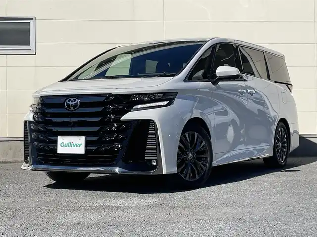 トヨタ ヴェルファイア ハイブリット Z プレミア 茨城県 2023(令5)年 1.4万km プラチナホワイトパールマイカ ワンオーナー/14インチメーカーナビ/パノラミックビューカメラ/フリップダウンモニター/ユニバーサルステップ/サンルーフ/電動サンシェード/LEDヘッドライト/両側パワースライドドア/パワーバックドア/純正フロアマット（エグゼクティブタイプ）/デジタルインナーミラー/カラーヘッドアップディスプレイ/BSM/茶色本革シート/シートヒーター/ベンチレーション/パワーシート/レーダークルーズコントロール/トヨタセーフティセンス