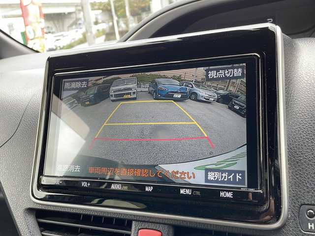トヨタ ヴォクシー ハイブリッド ZS 煌Ⅱ 沖縄県 2019(令1)年 10.6万km ブラック 純正ナビ/（ＡＭ／ＦＭ／ＣＤ／ＤＶＤ／ＢＴ）　/フルセグＴＶ　/衝突軽減装置　/横滑り防止装置　/盗難防止装置/レーンキープアシスト/前後コーナーセンサー　/両側パワースライドドア　/後席フリップダウンモニター　/ウォークスルー/ドライブレコーダー/スマートキー/プッシュスタート/クルーズコントロール　/バックカメラ/オートヘッドライト/LEDヘッドライト/シートカバー