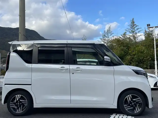日産 ルークス HWS X プロパイロットED 長崎県 2023(令5)年 2.2万km ホワイトパール ワンオーナー/純正ナビ（フルセグ、AM、FM、BTA）/バックカメラ/アラウンドビューモニター/プッシュスタート/両側パワースライドドア/アイドリングストップ/電動パーキング/オートホールド/追従クルーズコントロール/プロパイロット/車線逸脱警報/車線逸脱防止支援/エマージェンシーブレーキ/先行車発進お知らせ機能/速度標識表示/道路標識表示/前後クリアランスソナー/ふらつき警報/ステアリングリモコン/オートライト/電格ウィンカーミラー/ドアバイザー/フロアマット/スペアキー/リア用サーキュレーター/取扱説明書/ナビ取扱説明書/保証書