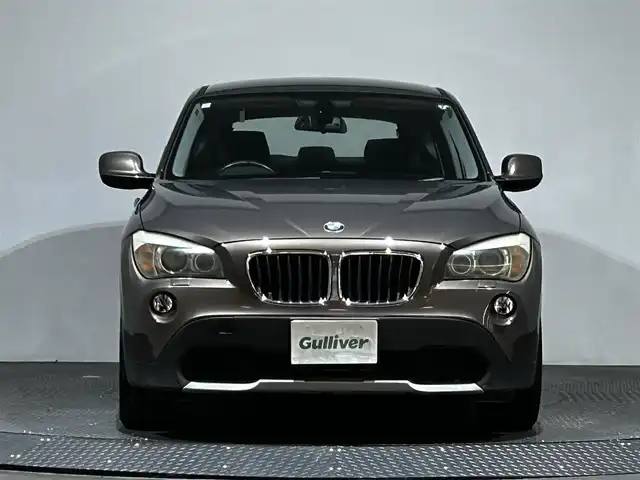 ＢＭＷ Ｘ１ 愛媛県 2010(平22)年 6.7万km ゴールド ・社外ナビ(CN-GP700FVD)/・バックカメラ/・CD＆AM/FM/・純正17インチアルミホイール/・プッシュスタート/・HIDヘッドライト