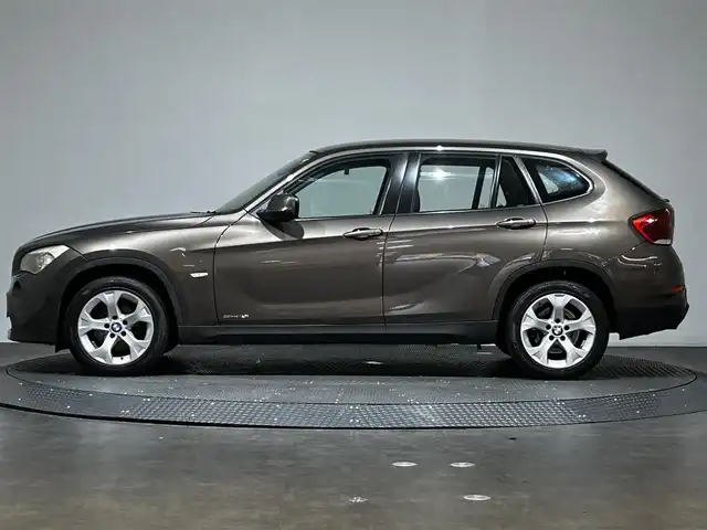ＢＭＷ Ｘ１ 愛媛県 2010(平22)年 6.7万km ゴールド ・社外ナビ(CN-GP700FVD)/・バックカメラ/・CD＆AM/FM/・純正17インチアルミホイール/・プッシュスタート/・HIDヘッドライト