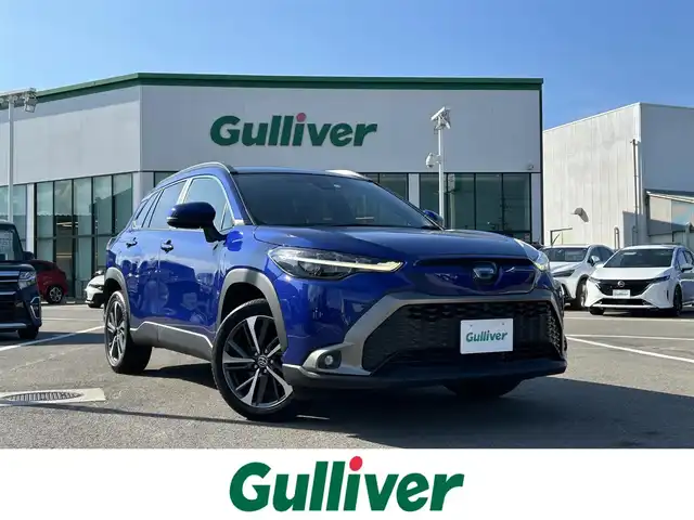 トヨタ カローラ クロス ハイブリッド Z 愛媛県 2023(令5)年 3.9万km ダークブルーマイカM 登録時走行距離：38194Km/純正OPメモリナビ/純正ビルトインETC2.0/追従クルコン/横滑り防止装置/盗難防止装置/衝突軽減システム/レーンキープアシスト/前後コーナーセンサー/LEDヘッドライト/オートライト/オートハイビーム/エンジンスタートボタン/シートヒーター/スマートキー/スペアキー一本/純正アルミホイール/ルーフレール