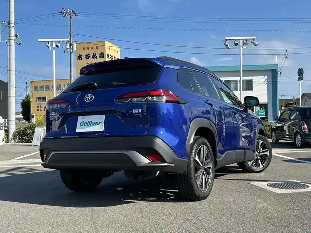 トヨタ カローラ クロス ハイブリッド Z 愛媛県 2023(令5)年 3.9万km ダークブルーマイカM 登録時走行距離：38194Km/純正OPメモリナビ/純正ビルトインETC2.0/追従クルコン/横滑り防止装置/盗難防止装置/衝突軽減システム/レーンキープアシスト/前後コーナーセンサー/LEDヘッドライト/オートライト/オートハイビーム/エンジンスタートボタン/シートヒーター/スマートキー/スペアキー一本/純正アルミホイール/ルーフレール