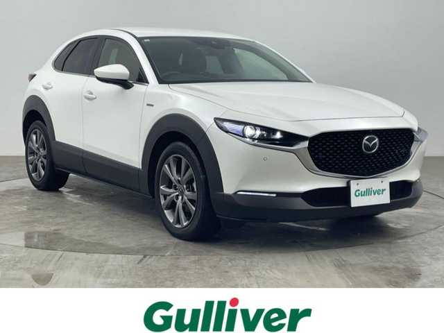 マツダ ＣＸ－３０ 20S 100周年特別記念車 大分県 2021(令3)年 2.6万km スノーフレイクホワイトパールマイカ ワンオーナー/100周年特別記念車装備/・創立100周年スペシャルロゴ/・レザーシート：レッド/・フロアマット/カーペット：レッド/・360°ビュー・モニター/・BOSEサウンドシステム/・CD/DVD+地上デジタルTVチューナー/・ボディカラー：スノーフレイクホワイトパールマイカ/・センターコンソール/ニーレストパッド/ドアアームレスト/　（ピュアホワイト）/・18インチアルミホイール（高輝度ダーク塗装）/・ドライバーモニタリング/・フロントパーキングセンサー/・スーパーUVカットガラス＋IRカットガラス/パワーリフトゲート/前席シートヒーター/ステアリングヒーター/純正ナビ/HDMI/BT/Apple Car Play/Android Auto/マツダレーダークルーズコントロール/ブラインドスポットモニター/ヘッドアップディスプレイ/リアパーキングセンサー/純正前後ドライブレコーダー/ビルトインETC/電動パーキングブレーキ/スペアキー/トノカバー/保証書・取扱説明書