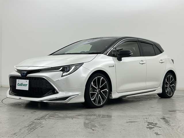 トヨタ カローラ スポーツ ハイブリッドG Z 宮城県 2020(令2)年 6万km アティチュードブラックマイカ/ホワイトパールクリスタルシャイン 禁煙車/モデリスタエアロ（F.S.R）/トヨタセーフティーセンス/・プリクラッシュセーフティーシステム/・レーダークルーズコントロール/・レーントレーシングアシスト/・オートマチックハイビーム/・パーキングサポートブレーキ/・ロードサインアシスト/・ソナー/ヘッドアップディスプレイ/前席シートヒーター/赤革スエードコンビシート/純正9インチディスプレイオーディオ/・BT.AM.FM.USB.Miracast/バックカメラ/フルセグテレビ/電動パーキングブレーキ/AUTOHOLD/ビルトインETC/プッシュスタート/スマートキー/革巻きステアリング/ステアリングスイッチ/純正フロアマット/純正ドアバイザー/純正18インチアルミホイール/LEDヘッドライト/LEDフォグランプ/横滑り防止機能/アイドリングストップ/ヘッドライトレベライザー