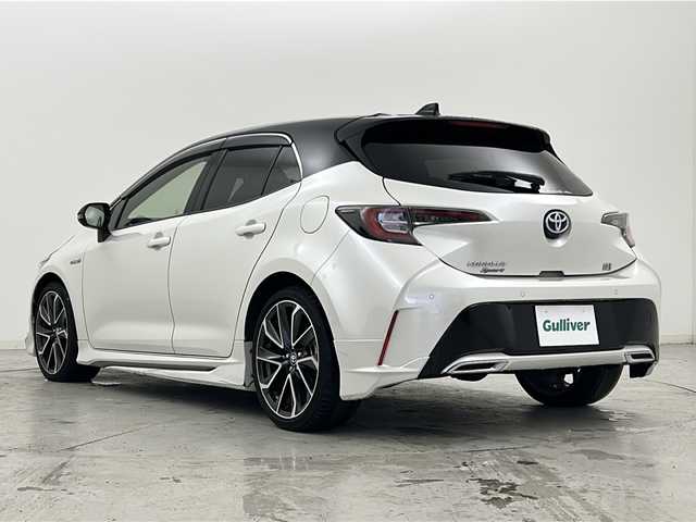 トヨタ カローラ スポーツ ハイブリッドG Z 宮城県 2020(令2)年 6万km アティチュードブラックマイカ/ホワイトパールクリスタルシャイン 禁煙車/モデリスタエアロ（F.S.R）/トヨタセーフティーセンス/・プリクラッシュセーフティーシステム/・レーダークルーズコントロール/・レーントレーシングアシスト/・オートマチックハイビーム/・パーキングサポートブレーキ/・ロードサインアシスト/・ソナー/ヘッドアップディスプレイ/前席シートヒーター/赤革スエードコンビシート/純正9インチディスプレイオーディオ/・BT.AM.FM.USB.Miracast/バックカメラ/フルセグテレビ/電動パーキングブレーキ/AUTOHOLD/ビルトインETC/プッシュスタート/スマートキー/革巻きステアリング/ステアリングスイッチ/純正フロアマット/純正ドアバイザー/純正18インチアルミホイール/LEDヘッドライト/LEDフォグランプ/横滑り防止機能/アイドリングストップ/ヘッドライトレベライザー