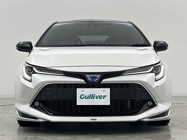 トヨタ カローラ スポーツ ハイブリッドG Z 宮城県 2020(令2)年 6万km アティチュードブラックマイカ/ホワイトパールクリスタルシャイン 禁煙車/モデリスタエアロ（F.S.R）/トヨタセーフティーセンス/・プリクラッシュセーフティーシステム/・レーダークルーズコントロール/・レーントレーシングアシスト/・オートマチックハイビーム/・パーキングサポートブレーキ/・ロードサインアシスト/・ソナー/ヘッドアップディスプレイ/前席シートヒーター/赤革スエードコンビシート/純正9インチディスプレイオーディオ/・BT.AM.FM.USB.Miracast/バックカメラ/フルセグテレビ/電動パーキングブレーキ/AUTOHOLD/ビルトインETC/プッシュスタート/スマートキー/革巻きステアリング/ステアリングスイッチ/純正フロアマット/純正ドアバイザー/純正18インチアルミホイール/LEDヘッドライト/LEDフォグランプ/横滑り防止機能/アイドリングストップ/ヘッドライトレベライザー