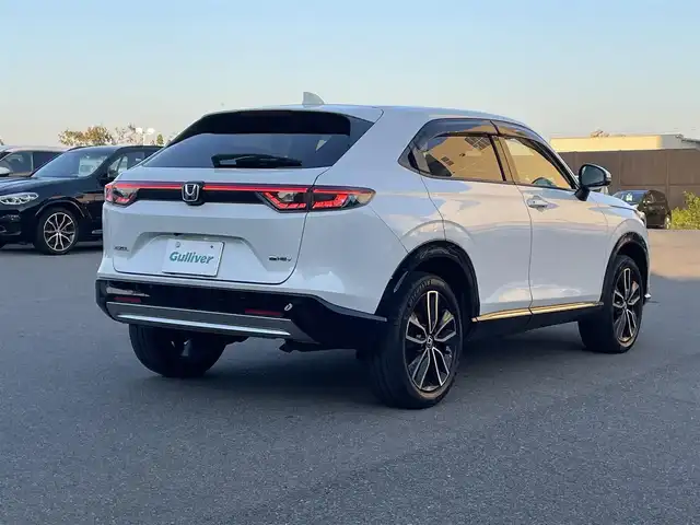 ホンダ ヴェゼル ハイブリッド e:HEV Z 山形県 2022(令4)年 3.7万km プラチナホワイトパール ホンダセンシング/純正メモリナビ/　　【BT　フルセグ　USB】/全周囲カメラ/電動リアゲート/レーダークルーズコントロール/LEDオートライト/ハーフレザーシート/シートヒーター/純正18インチアルミホイール/ブラインドスポットモニター/ダウンヒルアシストコントロール/ステアリングヒーター/ステアリングスイッチ/パドルシフト/ドライブレコーダー/スマートキー×2/ETC2.0