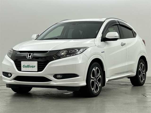 ホンダ ヴェゼル ハイブリッド Z 兵庫県 2015(平27)年 5万km ホワイトオーキッドパール 純正８型ナビ（ＢＴ，フルセグＴＶ）　/バックカメラ　/ＥＴＣ　/前後ドラレコ　/クルーズコントロール　/シティブレーキアクティブシステム/パドルシフト　/ハーフレザー　/シートヒーター　/純正１７インチアルミホイール
