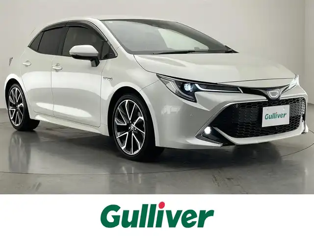 トヨタ カローラ スポーツ ハイブリッドG Z 愛知県 2018(平30)年 0.8万km ホワイトパールクリスタルシャイン 純正９型ナビ　メーカーオプションシート　シートヒーター　バックカメラ　ＢＳＭ　ＨＵＤ　ＡＣ１００Ｖ電源　ＥＴＣ　電動パーキング　前後ドラレコ　衝突軽減　追従クルコン　コーナーセンサー　ＬＥＤライト