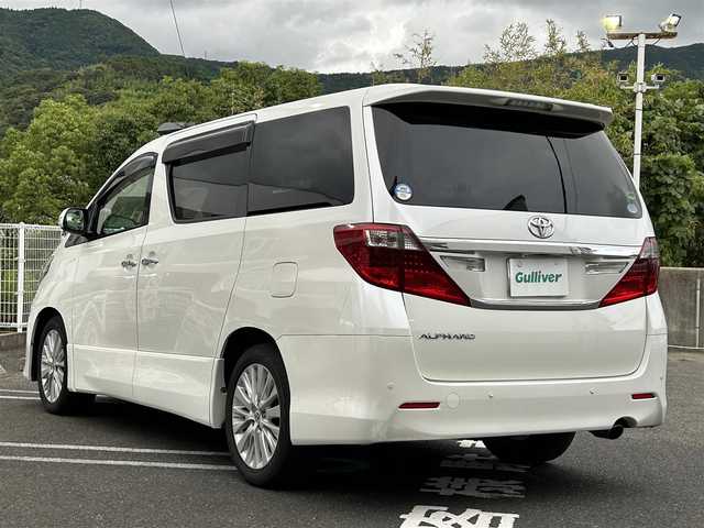 トヨタ アルファード 240S 長崎県 2012(平24)年 9.5万km ホワイトパールクリスタルシャイン 純正アルファード専用ナビ(FM/AM/CD/DVD/BT/TV)/プッシュスタート/スマートキー/ビルトインETC/純正フロアマット/純正アルミホイール/MTモード付AT/レザーシート/2列目オットマン/3列シート/後席用モニター/両側イージークローザードア/バックカメラ/オートライト/ABS/横滑り防止装置(VSC)/盗難防止装置/取扱説明書/記録簿/保証書