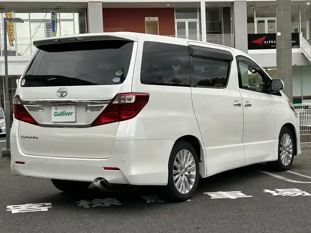トヨタ アルファード 240S 長崎県 2012(平24)年 9.5万km ホワイトパールクリスタルシャイン 純正アルファード専用ナビ(FM/AM/CD/DVD/BT/TV)/プッシュスタート/スマートキー/ビルトインETC/純正フロアマット/純正アルミホイール/MTモード付AT/レザーシート/2列目オットマン/3列シート/後席用モニター/両側イージークローザードア/バックカメラ/オートライト/ABS/横滑り防止装置(VSC)/盗難防止装置/取扱説明書/記録簿/保証書