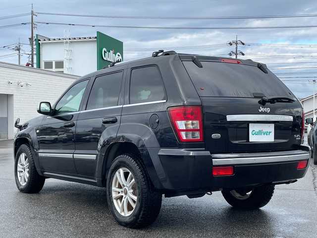 クライスラー・ジープ ジープ グランドチェロキー オーバーランド 5．7 HEMI 富山県 2008(平20)年 9.3万km 黒 純正ナビ/【CD/DVD/FM/アナログTV】/ガラスルーフ/4WD/コーナーセンサー（バック）/リアモニター/クルーズコントロール/シートヒーター（前席）/パワーシート/社外アルミホイール/積み込みサマータイヤ（AW付）/リモコンキー/電動リアゲート（確認できず）