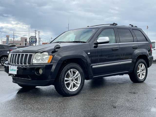 クライスラー・ジープ ジープ グランドチェロキー オーバーランド 5．7 HEMI 富山県 2008(平20)年 9.3万km 黒 純正ナビ/【CD/DVD/FM/アナログTV】/ガラスルーフ/4WD/コーナーセンサー（バック）/リアモニター/クルーズコントロール/シートヒーター（前席）/パワーシート/社外アルミホイール/積み込みサマータイヤ（AW付）/リモコンキー/電動リアゲート（確認できず）