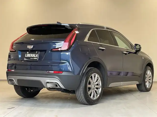 キャデラック ＸＴ４ プレミアム 熊本県 2022(令4)年 1.7万km 紺 ・スマートキー/・プッシュスタート/・前面衝突警告ブレーキ/・前後歩行者検知/・レーンキープアシスト/・リアクロストラフィックアラート/・オートハイビーム/・クルーズコントロール(追従式)/・黒革シート/・前席パワーシート/・全席シートヒーター /・ハンドルヒーター /・純正ディスプレイオーディオ/　【Bluetooth・USB・AppleCarPlay・AndroidAuto】/・BOSEサウンドシステム/・全方位カメラ/・ETC/・パワーバックドア/・LEDヘッドランプ/・純正マット