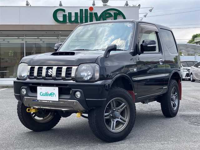 スズキ ジムニー ランドベンチャー 三重県 2015(平27)年 6万km ブルーイッシュブラックパール3 ♪走行60049km/♪4WD/ターボ/リフトアップ/社外マフラー(MRS)/社外テールレンズ/MRSターボインテークチャンバー/牽引フック(フロント/リア)/ハーフレザー/前席シートヒーター/社外ナビ/・DVD再生・USB/・フルセグ・SD/・Bluetoothオーディオ/LEDヘッドライト/LEDフォグライト/純正15インチAW/背面タイヤ/ウィンカーミラー /前後ドライブレコーダー/ステアリングスイッチ/ヘッドライトレベライザー/革巻シフトノブ/フロアマット/ドアバイザー/電格ミラー/ETC2.0