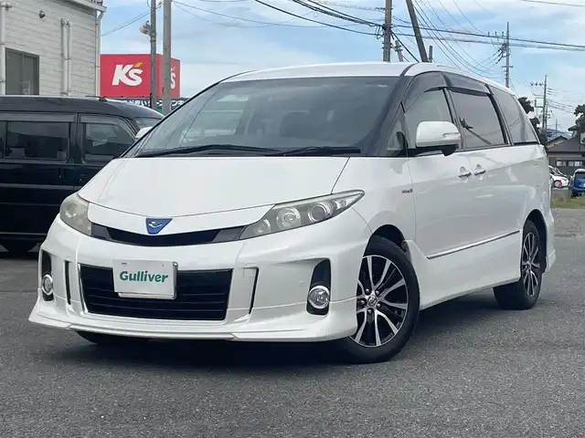 トヨタ エスティマ ハイブリッド アエラス 道央・札幌 2013(平25)年 7.1万km ホワイトパールクリスタルシャイン ワンオーナー/４WD/純正メモリナビ、地デジ、Bluetooth、CD、DVD/　（NHZN-X62G）/バックカメラ/クルーズコントロール/革巻きステア/ビルトインETC/HIDヘッドライト/ウインカーミラー/純正ドライブレコーダー（前方録画）/スマートキー×２/両側パワースライドドア/運転席パワーシート/コーナーセンサー（前後）/保証書、取説