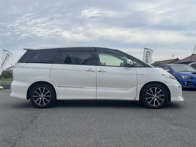 トヨタ エスティマ ハイブリッド アエラス 道央・札幌 2013(平25)年 7.1万km ホワイトパールクリスタルシャイン ワンオーナー/４WD/純正メモリナビ、地デジ、Bluetooth、CD、DVD/　（NHZN-X62G）/バックカメラ/クルーズコントロール/革巻きステア/ビルトインETC/HIDヘッドライト/ウインカーミラー/純正ドライブレコーダー（前方録画）/スマートキー×２/両側パワースライドドア/運転席パワーシート/コーナーセンサー（前後）/保証書、取説