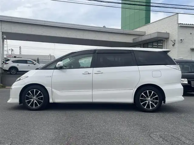 トヨタ エスティマ ハイブリッド アエラス 道央・札幌 2013(平25)年 7.1万km ホワイトパールクリスタルシャイン ワンオーナー/４WD/純正メモリナビ、地デジ、Bluetooth、CD、DVD/　（NHZN-X62G）/バックカメラ/クルーズコントロール/革巻きステア/ビルトインETC/HIDヘッドライト/ウインカーミラー/純正ドライブレコーダー（前方録画）/スマートキー×２/両側パワースライドドア/運転席パワーシート/コーナーセンサー（前後）/保証書、取説