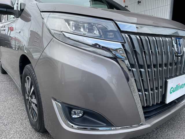 トヨタ エスクァイア ハイブリッド Gi プレミアムパッケージ 神奈川県 2018(平30)年 6.8万km アバンギャルドブロンズメタリック 純正ナビ/AM/FM/DVD/CD/Bluetooth接続/HDMI接続/USB接続/フルセグTV/純正フリップダウンモニター/クルーズコントロール/両側パワースライドドア/前席シートヒーター/ビルトインETC/前方ドライブレコーダー/フロント＋バックカメラ/トヨタセーフティーセンス/LEDライト/オートライト