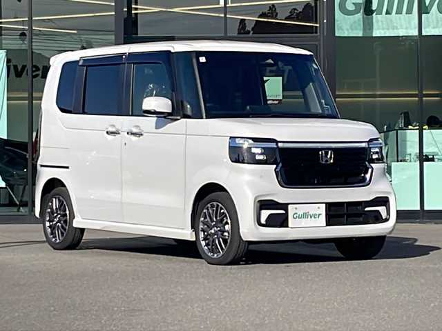 ホンダ Ｎ ＢＯＸ カスタム ターボ 鹿児島県 2024(令6)年 0.4万km プラチナホワイトパール ワンオーナー/純正7インチナビ/フルセグテレビ/BT/USB/FM.AM/両側パワースライドドア/衝突軽減ブレーキ/車線逸脱防止機能/オートハイビーム/レーダークルーズコントロール/踏み間違い衝突軽減システム/パーキングセンサー警報/ステアリングスイッチ/電動ミラー/フロアマット/ドアバイザー/純正15インチアルミホイール/スマートキー×2/保証書/取扱説明書