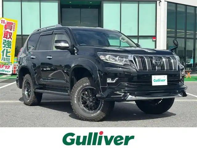 トヨタ ランドクルーザー プラド TX Lパッケージ 奈良県 2020(令2)年 2.1万km ブラック WALDエアロ/サンルーフ/carrozzeria9インチナビ（AVIC-RQ903）/（フルセグ／ＢＴ／ＣＤ／ＤＶＤ）/ALPINEヘッドレストモニター/ベージュレザーシート/レーダークルーズコントロール/バックカメラ/前後コーナーセンサー/プリクラッシュセーフティ/レーンキープアシスト/前席パワーシート/前席シートヒーター／エアーシート/前後ドライブレコーダー（CS-91FH）/ヘッドライトウォッシャー/ETC/ブロックタイヤ/NITROPOWER17インチAW/保証書/取り扱い説明書/スペアキーX1