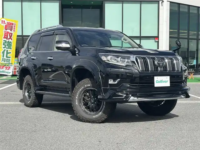 トヨタ ランドクルーザー プラド TX Lパッケージ 奈良県 2020(令2)年 2.1万km ブラック WALDエアロ/サンルーフ/carrozzeria9インチナビ（AVIC-RQ903）/（フルセグ／ＢＴ／ＣＤ／ＤＶＤ）/ALPINEヘッドレストモニター/ベージュレザーシート/レーダークルーズコントロール/バックカメラ/前後コーナーセンサー/プリクラッシュセーフティ/レーンキープアシスト/前席パワーシート/前席シートヒーター／エアーシート/前後ドライブレコーダー（CS-91FH）/ヘッドライトウォッシャー/ETC/ブロックタイヤ/NITROPOWER17インチAW/保証書/取り扱い説明書/スペアキーX1