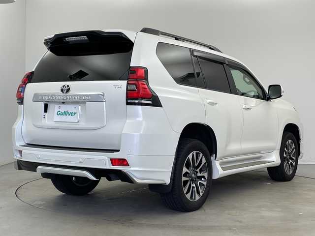 トヨタ ランドクルーザー プラド TX Lパッケージ 新潟県 2022(令4)年 3.2万km ホワイトパールクリスタルシャイン 7人乗り/サンルーフ/モデリスタエアロ/ベージュ革シート/純正メーカーOPナビ/パノラミックビューモニター/プリクラッシュセーフティ/レーダークルーズコントロール/レーンキープアシスト/ブラインドスポットモニター/エアシート/ビルトインETC/ドライブレコーダー/前席パワーシート/オートライト/オートハイビーム/LEDヘッドライト/前後コーナーセンサー/プッシュスタート