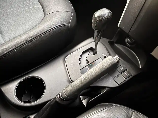 トヨタ ｉＱ 130G レザーパッケージ 熊本県 2012(平24)年 4.7万km オレンジM 純正メモリナビ（NSLN-W62）/【フルセグTV/Bluetooth/HDMI/USB】/ハーフレザーシート/純正16インチアルミホイール/社外車高調/ETC/ステアリングスイッチ/革巻きステアリング/M/Tモード/横滑り防止/プッシュスタート/スマートキー/ウインカーミラー/オートライト/オートエアコン/純正フロアマット