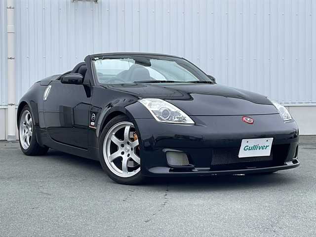 日産 フェアレディ Ｚ ロードスター バージョンST 三重県 2007(平19)年 3.7万km ダイヤモンドブラック IMPULマフラー/IMPULエアロ/スペアキー/電動格納ミラー/ビルトインETC/オートエアコン/バックカメラ/純正DVDナビ/BOSEプレミアムサウンド/純正フロアマット/パワーシート(D＋N席)/シートヒーター(D＋N席)/革巻きステアリング/電動オープン/横滑り防止/取扱説明書/保証書/momoステアリング