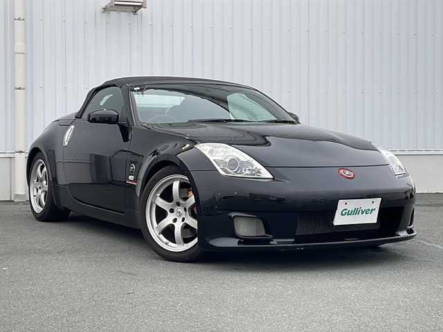 日産 フェアレディ Ｚ ロードスター バージョンST 三重県 2007(平19)年 3.7万km ダイヤモンドブラック IMPULマフラー/IMPULエアロ/スペアキー/電動格納ミラー/ビルトインETC/オートエアコン/バックカメラ/純正DVDナビ/BOSEプレミアムサウンド/純正フロアマット/パワーシート(D＋N席)/シートヒーター(D＋N席)/革巻きステアリング/電動オープン/横滑り防止/取扱説明書/保証書/momoステアリング