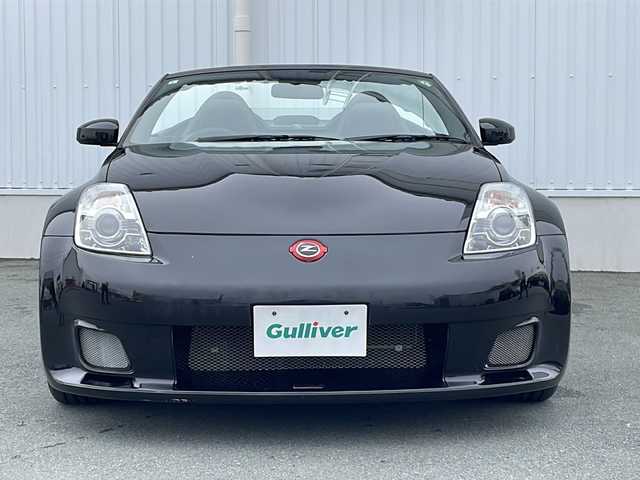 日産 フェアレディ Ｚ ロードスター バージョンST 三重県 2007(平19)年 3.7万km ダイヤモンドブラック IMPULマフラー/IMPULエアロ/スペアキー/電動格納ミラー/ビルトインETC/オートエアコン/バックカメラ/純正DVDナビ/BOSEプレミアムサウンド/純正フロアマット/パワーシート(D＋N席)/シートヒーター(D＋N席)/革巻きステアリング/電動オープン/横滑り防止/取扱説明書/保証書/momoステアリング