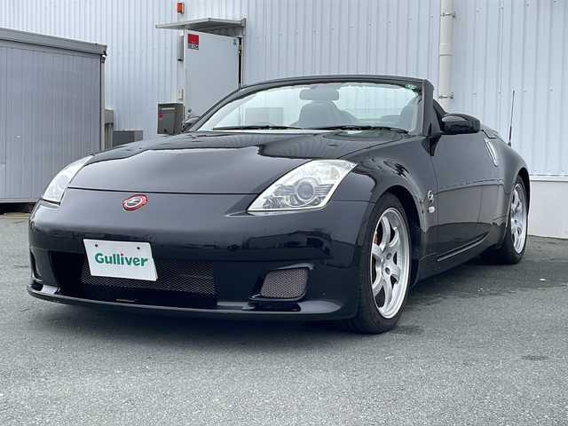 日産 フェアレディ Ｚ ロードスター バージョンST 三重県 2007(平19)年 3.7万km ダイヤモンドブラック IMPULマフラー/IMPULエアロ/スペアキー/電動格納ミラー/ビルトインETC/オートエアコン/バックカメラ/純正DVDナビ/BOSEプレミアムサウンド/純正フロアマット/パワーシート(D＋N席)/シートヒーター(D＋N席)/革巻きステアリング/電動オープン/横滑り防止/取扱説明書/保証書/momoステアリング