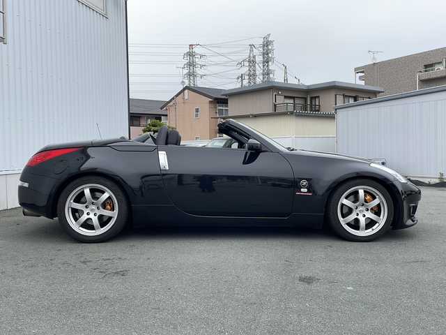 日産 フェアレディ Ｚ ロードスター バージョンST 三重県 2007(平19)年 3.7万km ダイヤモンドブラック IMPULマフラー/IMPULエアロ/スペアキー/電動格納ミラー/ビルトインETC/オートエアコン/バックカメラ/純正DVDナビ/BOSEプレミアムサウンド/純正フロアマット/パワーシート(D＋N席)/シートヒーター(D＋N席)/革巻きステアリング/電動オープン/横滑り防止/取扱説明書/保証書/momoステアリング
