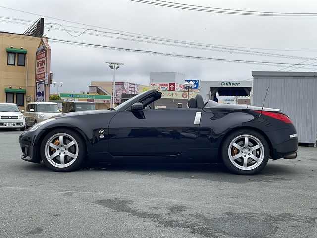 日産 フェアレディ Ｚ ロードスター バージョンST 三重県 2007(平19)年 3.7万km ダイヤモンドブラック IMPULマフラー/IMPULエアロ/スペアキー/電動格納ミラー/ビルトインETC/オートエアコン/バックカメラ/純正DVDナビ/BOSEプレミアムサウンド/純正フロアマット/パワーシート(D＋N席)/シートヒーター(D＋N席)/革巻きステアリング/電動オープン/横滑り防止/取扱説明書/保証書/momoステアリング