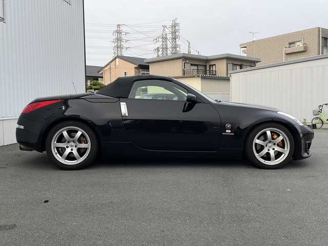 日産 フェアレディ Ｚ ロードスター バージョンST 三重県 2007(平19)年 3.7万km ダイヤモンドブラック IMPULマフラー/IMPULエアロ/スペアキー/電動格納ミラー/ビルトインETC/オートエアコン/バックカメラ/純正DVDナビ/BOSEプレミアムサウンド/純正フロアマット/パワーシート(D＋N席)/シートヒーター(D＋N席)/革巻きステアリング/電動オープン/横滑り防止/取扱説明書/保証書/momoステアリング