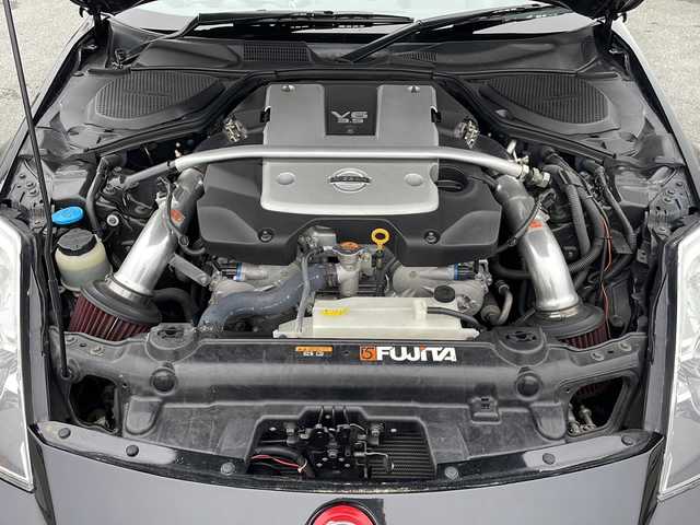 日産 フェアレディ Ｚ ロードスター バージョンST 三重県 2007(平19)年 3.7万km ダイヤモンドブラック IMPULマフラー/IMPULエアロ/スペアキー/電動格納ミラー/ビルトインETC/オートエアコン/バックカメラ/純正DVDナビ/BOSEプレミアムサウンド/純正フロアマット/パワーシート(D＋N席)/シートヒーター(D＋N席)/革巻きステアリング/電動オープン/横滑り防止/取扱説明書/保証書/momoステアリング