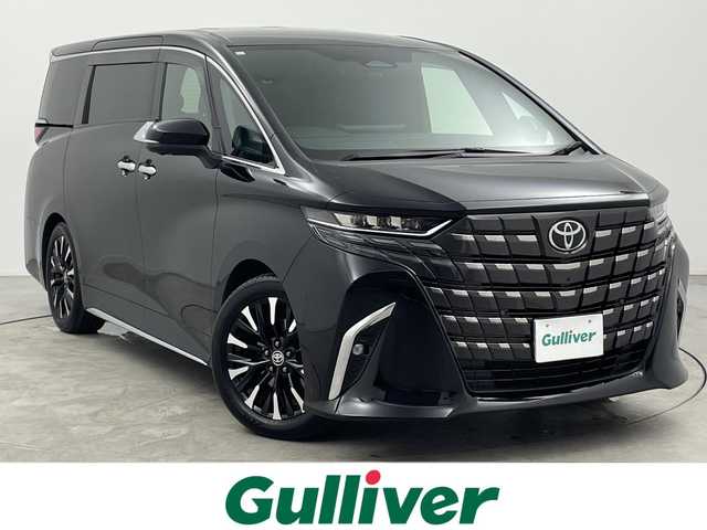 トヨタ アルファードハイブリット エグゼクティブ ラウンジ 三重県 2023(令5)年 2.6万km ブラック 禁煙車/ワンオーナー/純正ナビ/（CD/DVD/BT/AppleCarPlay/AndroidAuto）/フルセグTV/左右独立ムーンルーフ/14インチフリップダウンモニター/JBLスピーカー/デジタルインナーミラー/シートヒーター/ベンチレーション/パノラミックビューモニター/ブラインドスポットモニター/カラーヘッドアップディスプレイ/ステアリングヒーター/後席用パワーサイドサンシェード/純正19インチアルミホイール