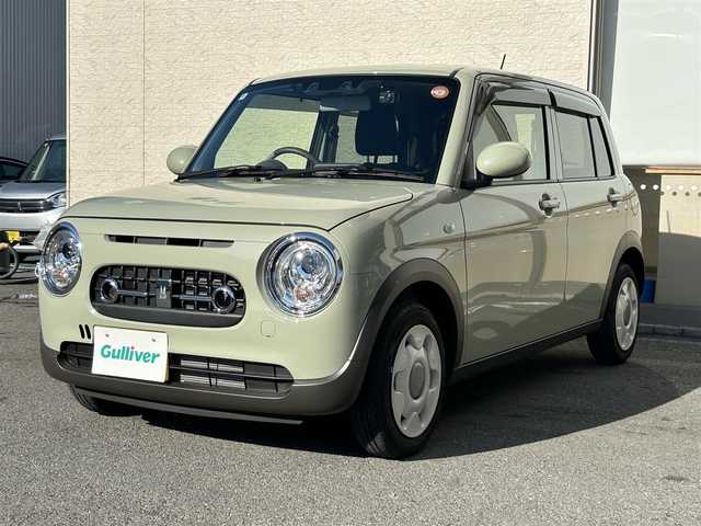 スズキ ラパン ＬＣ L 大阪府 2024(令6)年 0.4万km トラッドカーキメタリック ディスプレイオーディオ BT USB/バックカメラ/シートヒーター/前後ドラレコ/ETC/スマートキー/プッシュエンジンスタート/衝突被害軽減ブレーキ/レーンアシスト/オートマチックハイビーム/LEDオートヘッドライト/バックソナー/革巻きステアリング/横滑り防止/保証書 取説/禁煙車