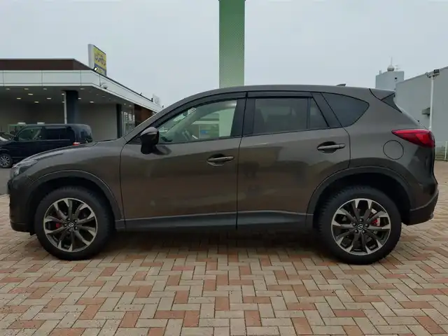 マツダ ＣＸ－５ XD Lパッケージ 新潟県 2016(平28)年 10.9万km チタニウムフラッシュマイカ (株)IDOMが運営する【じしゃロン新潟店】の自社ローン専用車両になります。/こちらは現金またはオートローンご利用時の価格です。自社ローンご希望の方は別途その旨お申付け下さい/ワンオーナー/4WD/純正SDナビ/FM/AM/CD/DVD視聴可能/フルセグTV視聴可能(走行中視聴不可)/Bluetooth/USB/AUX接続可能/バックカメラ/ETC/クルーズコントロール/プッシュスタート/電動パーキングブレーキ/シートメモリー機能/パワーシート(D席+N席)/シートヒーター(D席+N席)/レーンキープアシスト機能/電動格納ウィンカーミラー/コーナーセンサー(後方のみ)/スマートキー/取扱説明書