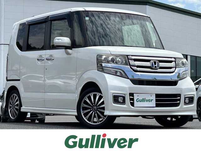 ホンダ Ｎ ＢＯＸ カスタム G ターボ Lパッケージ 島根県 2015(平27)年 6.9万km プレミアムホワイトパールⅡ CTBA/純正ナビ/CD/DVD/DTV/Bluetooth/バックカメラ/両側パワースライドドア/クルーズコントロール/ETC/ステアリングスイッチ/パドルシフト/HIDオートライト/純正フロアマット/ドアバイザー/純正アルミホイール/スマートキー/プッシュスタート