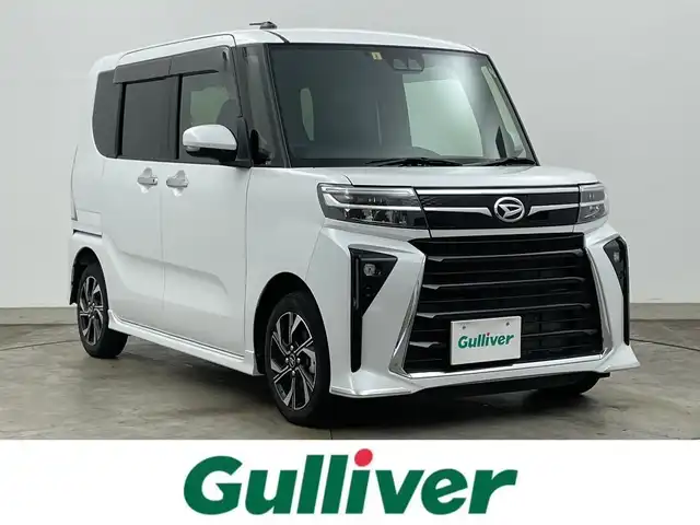 ダイハツ タント カスタム X 岡山県 2023(令5)年 1.3万km シャイニングホワイトパール 純正９型ディスプレイオーディオ　/【BT/HDMI接続/フルセグ/Carplay】/両側パワースライドドア　/シートヒーター　/ＬＥＤヘッドライト　/ＥＴＣ　/バックカメラ　　/コーナーセンサー前後/オートハイビーム　/アイドリングストップ/踏み間違い防止/オートブレーキホールド/後席サンシェイド/ステアリングスイッチ/ドアバイザー/新車保証書/取扱説明書/スペアキー×1