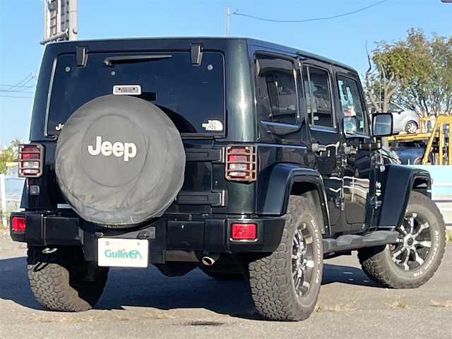 クライスラー・ジープ ジープ ラングラー アンリミテッド サハラ 道央・札幌 2012(平24)年 7.3万km ブラックフォレストグリーン ４WD/社外メモリーナビ/CD/DVD/BT/フルセグ/横滑り防止装置/クルーズコントロール/バックカメラ/サイドカメラ/ETC/トランスファレバー/ドライブレコーダー/革巻きステアリング/ステアリングリモコン/MTモード付AT/リモコンキー/ハロゲンヘッドライト/オートライト/フォグランプ/ヘッドライトレベライザー/ヒーテッドドアミラー/スペアキー/純正AW付冬タイヤ積込/265/65/R17/2019年/山8mm