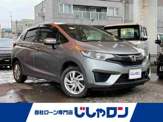 ホンダ フィット ハイブリット Lパッケージ 道央・札幌 2016(平28)年 8.4万km ティンテッドシルバーM (株)IDOMが運営する【じしゃロン札幌店】の自社ローン専用車両になりますこちらは現金またはオートローンご利用価格です。自社ローンご希望の方は別途その旨お申し付けください。・/４WD/純正8インチプレミアムインターナビ(VXM-165VFEi)/(AM/FM/ワンセグ/CD/DVD/Bluetooth/USB)/クルーズコントロール/ビルトインETC/純正フロアマット/プッシュスタート/保証書/取説