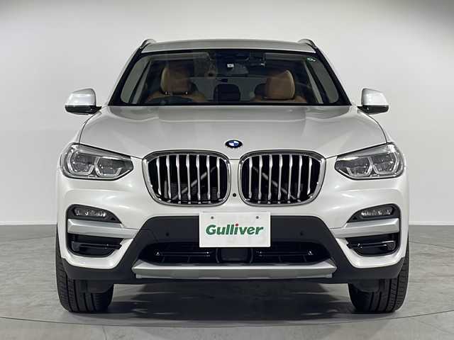 ＢＭＷ Ｘ３ xDrive20d Xライン 福岡県 2021(令3)年 2.4万km ミネラルホワイト ・純正メーカーナビ　/（ＡＭ　ＦＭ　ＢＴ9/・フルセグTV　/・ＥＴＣ　/・バックカメラ　/・全方位カメラ　/・前後ドラレコ　/・ＢＳＭ　/・クルコン/・横滑り防止　/・レーンキープアシスト　/・前後コーナーセンサー/・パワーバックドア　/・パーワーシート　/・シートメモリー　/・革巻きステアリング/・純正フロアマット/・純正19インチアルミ/・オートライト/・オートハイビーム