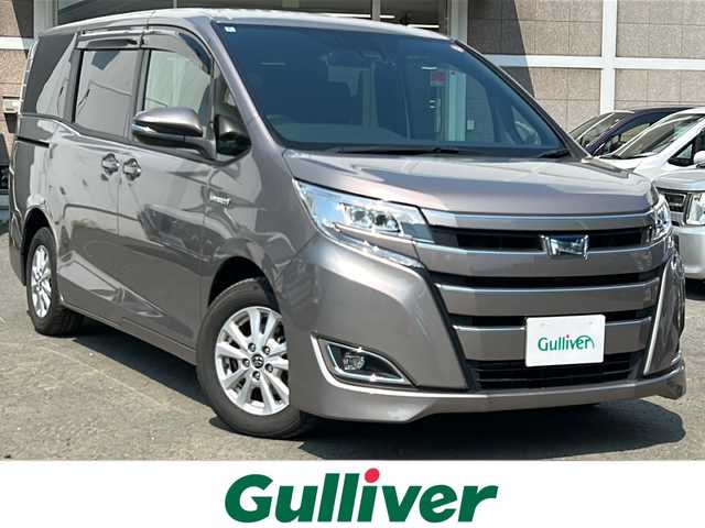 トヨタ ノア ハイブリッド G 道央・札幌 2018(平30)年 7.7万km アバンギャルドブロンズメタリック ・純正9インチナビ/・フルセグTV/DVD/CD/SD/BT/・バックカメラ/・寒冷地仕様/・両側パワースライドドア/・ドライブレコーダー/・プリクラッシュセーフティ/・クルーズコントロール/・レーンディパーチャーアラート/・オートマチックハイビーム/・ワイパーデアイサー/・トラクションコントロール/・ビルトインETC/・AC100V1500W電源/・前席シートヒーター/・LEDヘッドライト/・LEDフォグ/・プッシュスタート/・スマートキー/・ドアバイザー/・電格ミラー
